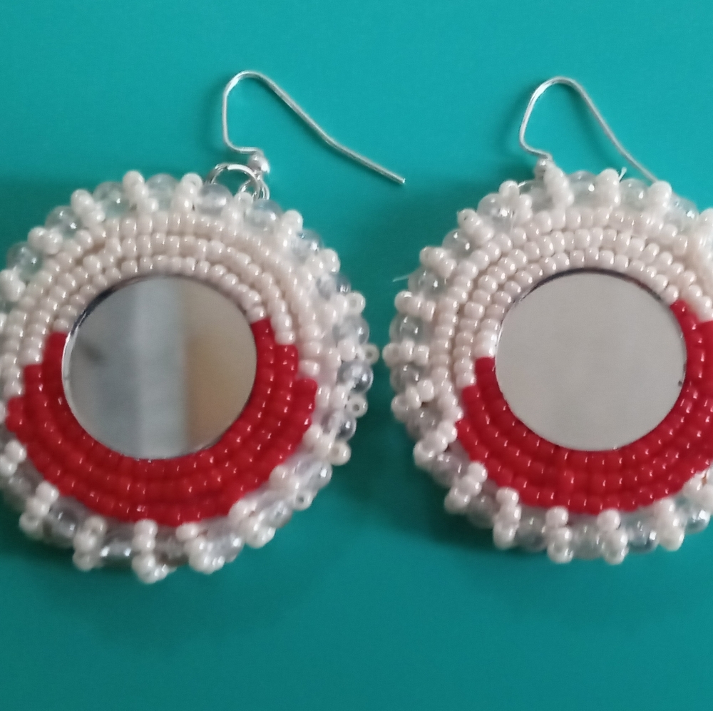 Red and white beaded earrings with hooks.